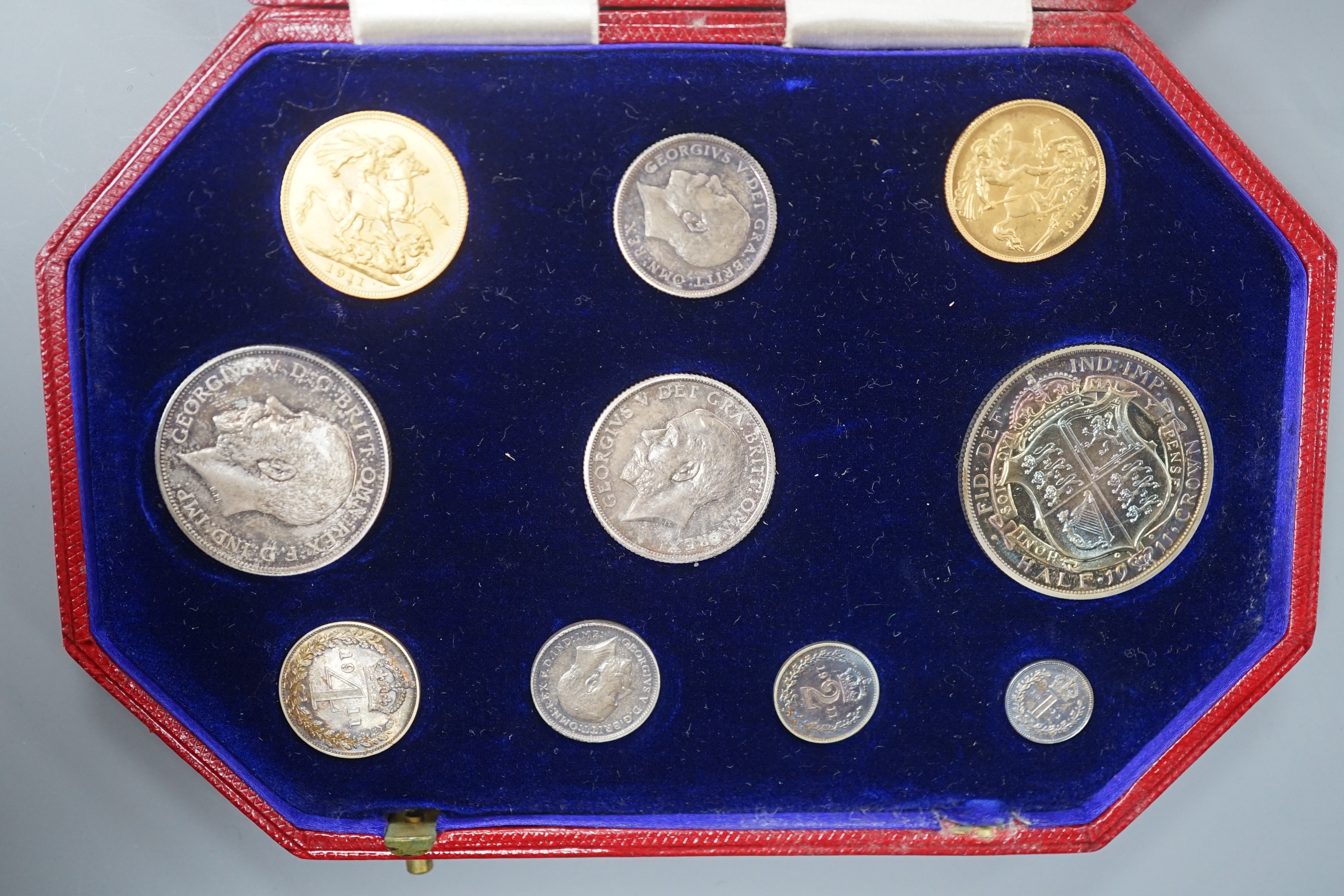 A George V specimen coin set 1911, comprising gold sovereign, and half sovereign, silver half crown, florin, shilling, 6d and Maundy 1d– 4d, UNC with toning to silver coins
